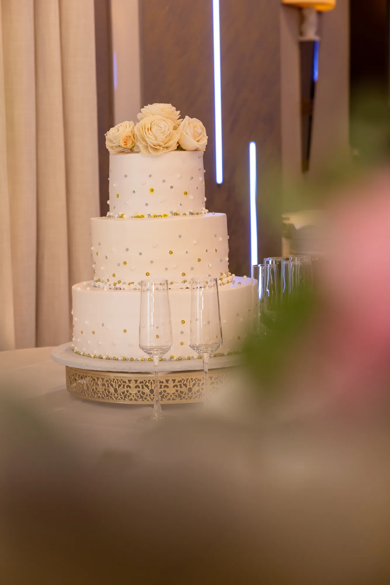 Tiered wedding cake lit by vertical LED bars at De Luxe Banquet Hall, Burbank