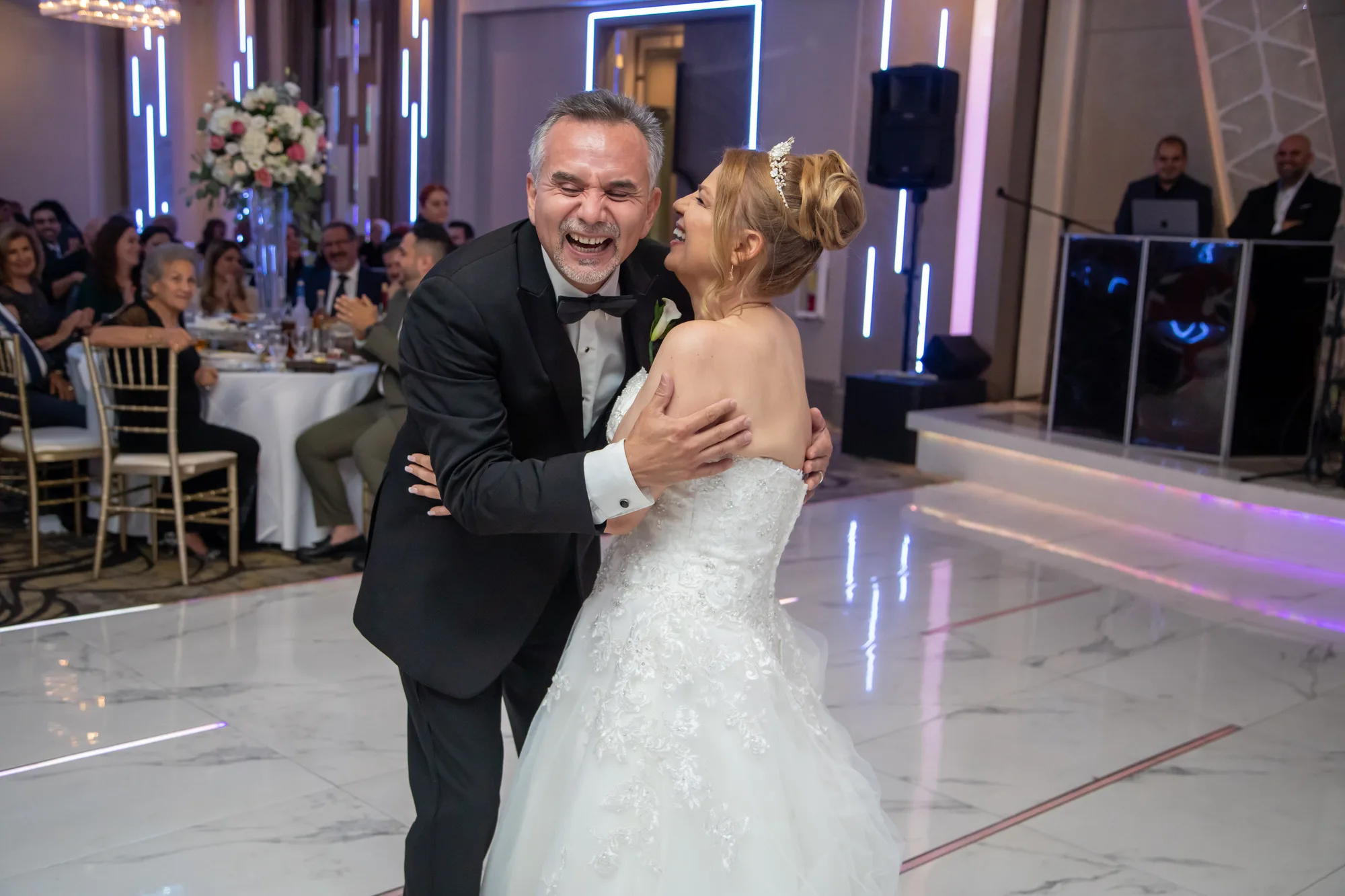 Bride and groom dancing on the mirrored floor at De Luxe Banquet Hall, Burbank