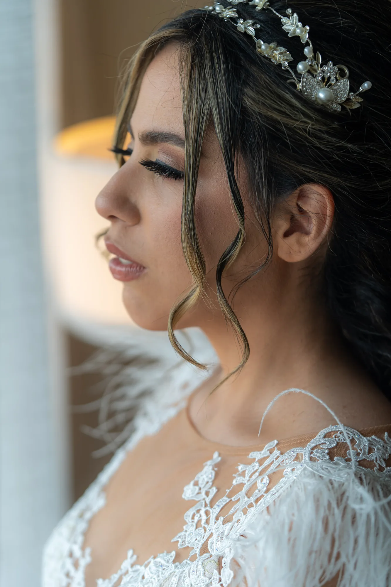 Bride in soft window light during hair and makeup at Paséa Hotel & Spa, Huntington Beach