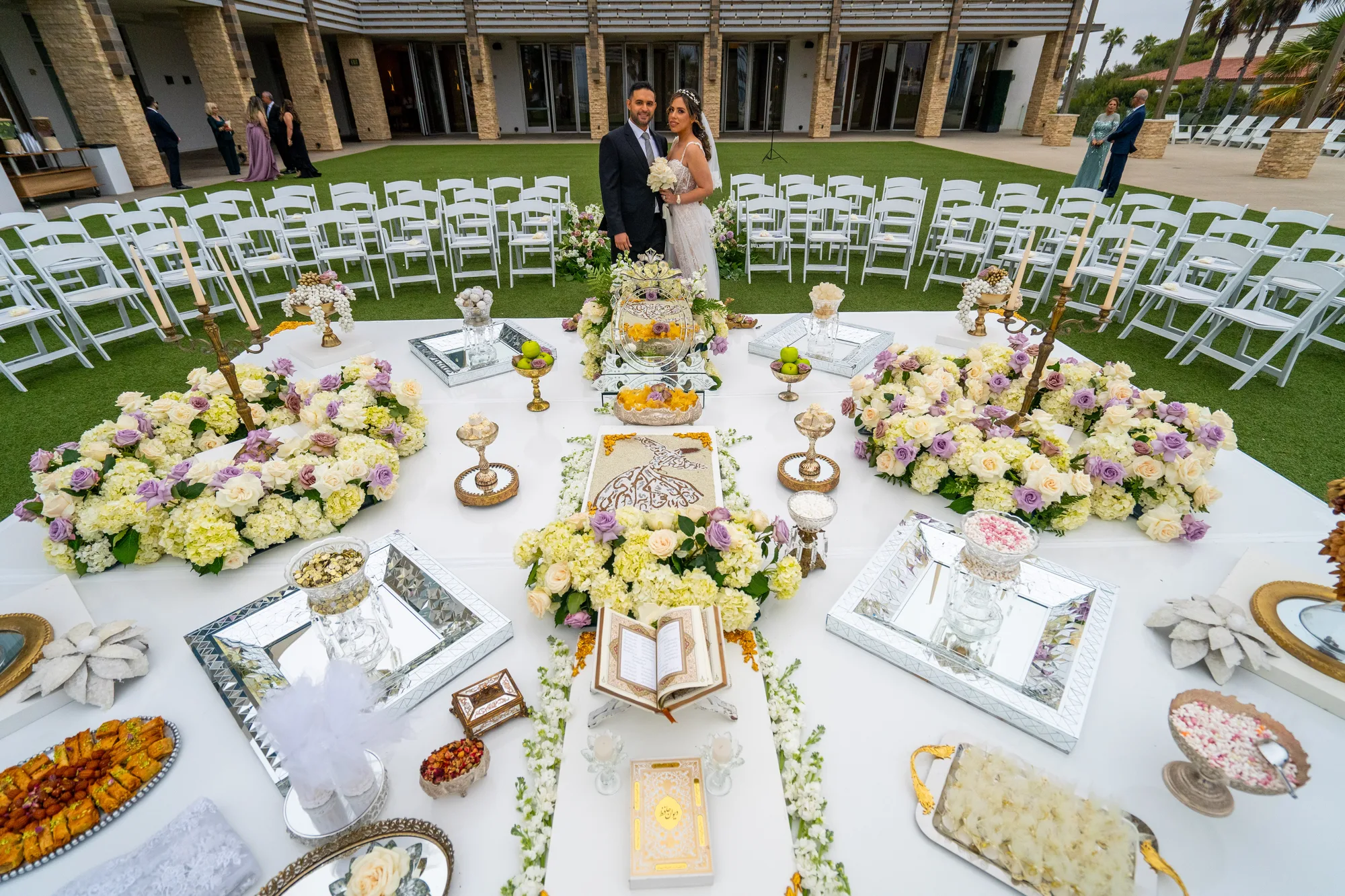 Overhead frame of the Persian sofreh aghd laid on the Ocean Lawn at Paséa Hotel & Spa