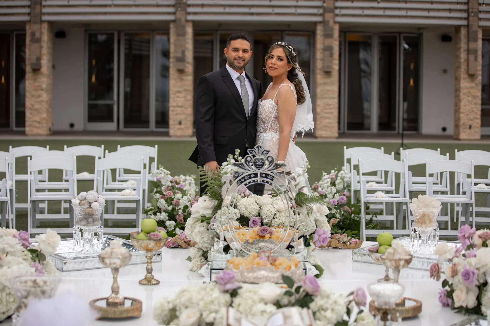 Bride and groom seated at the sofreh aghd during a Persian ceremony at Paséa Hotel & Spa