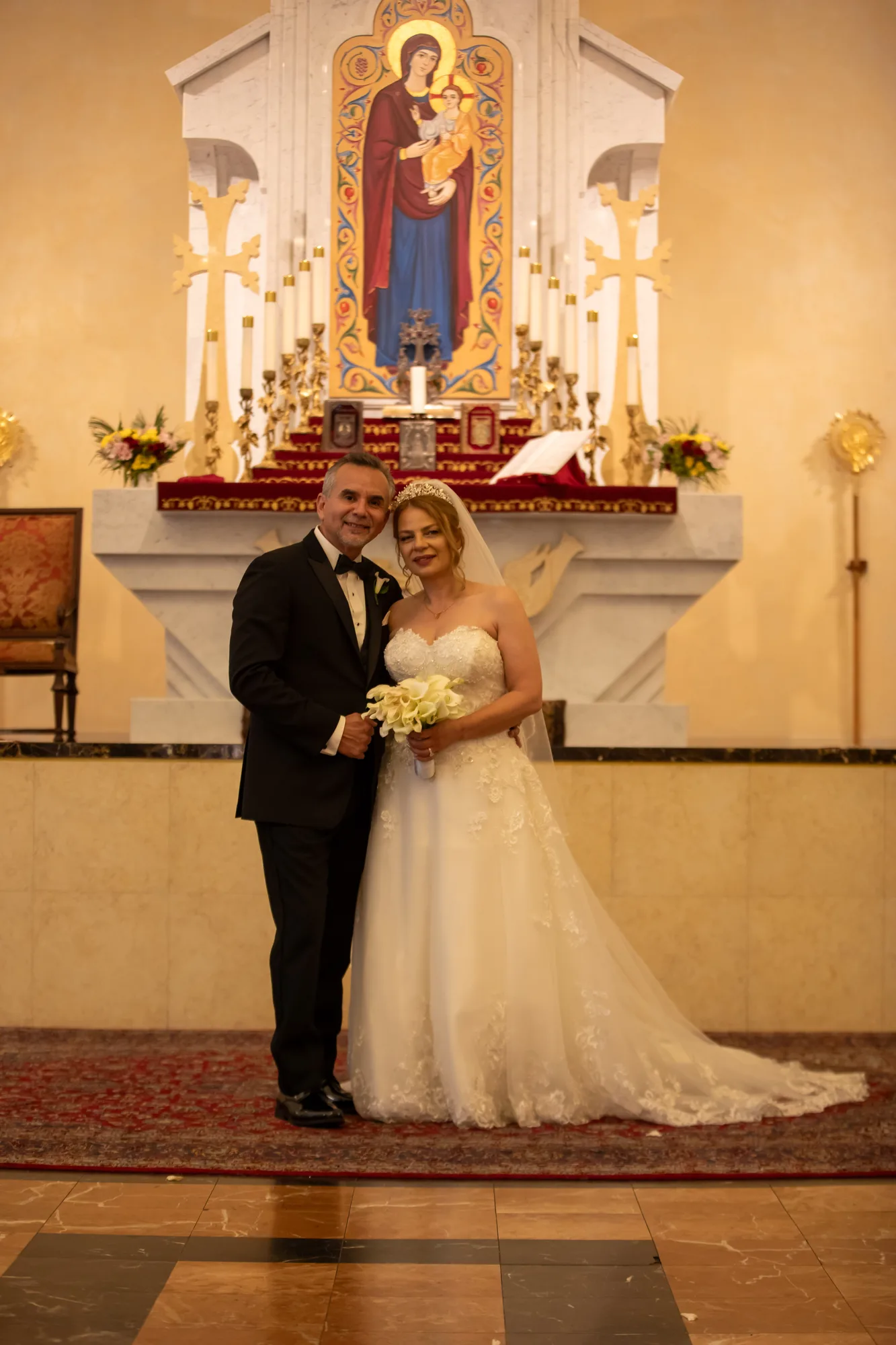 Bride and groom at the marble altar of St. Leon Armenian Cathedral, Burbank