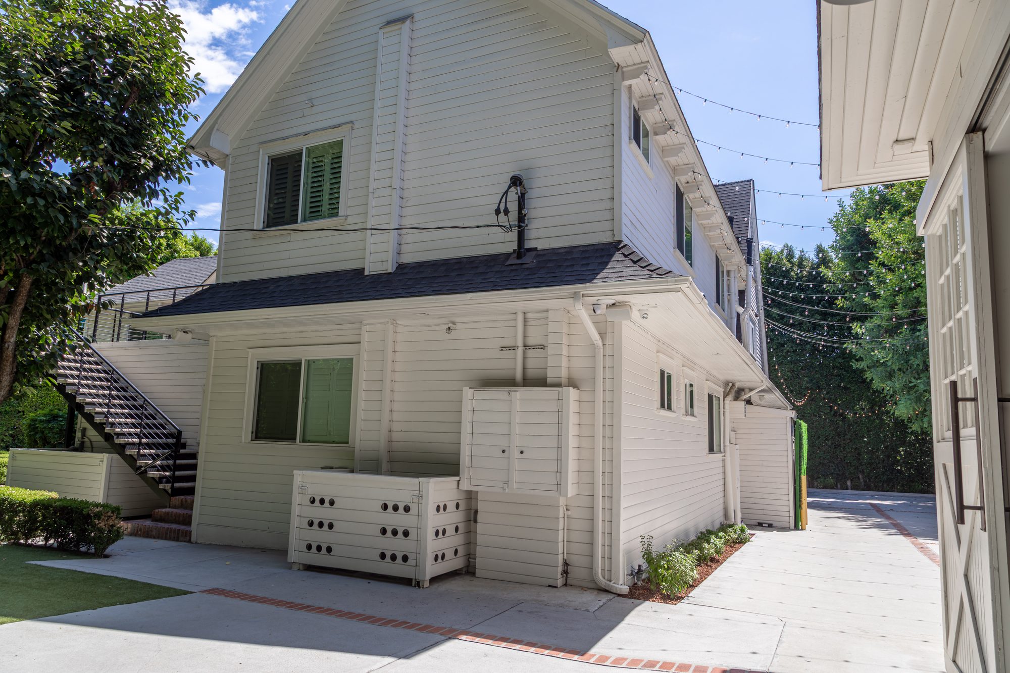 The side of the barn at Lombardi House with its outdoor stair