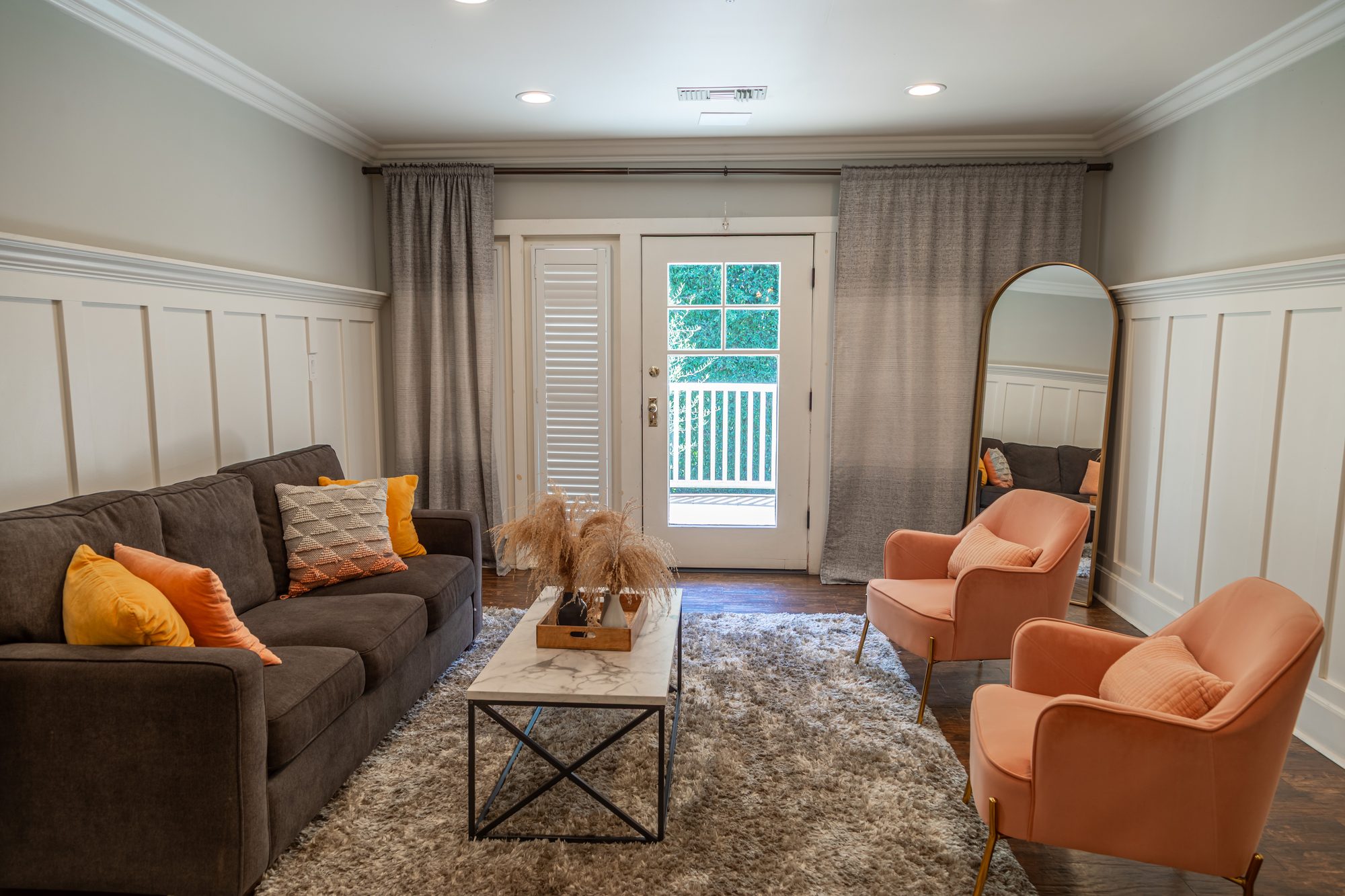 A sitting room at Lombardi House, French doors to the garden
