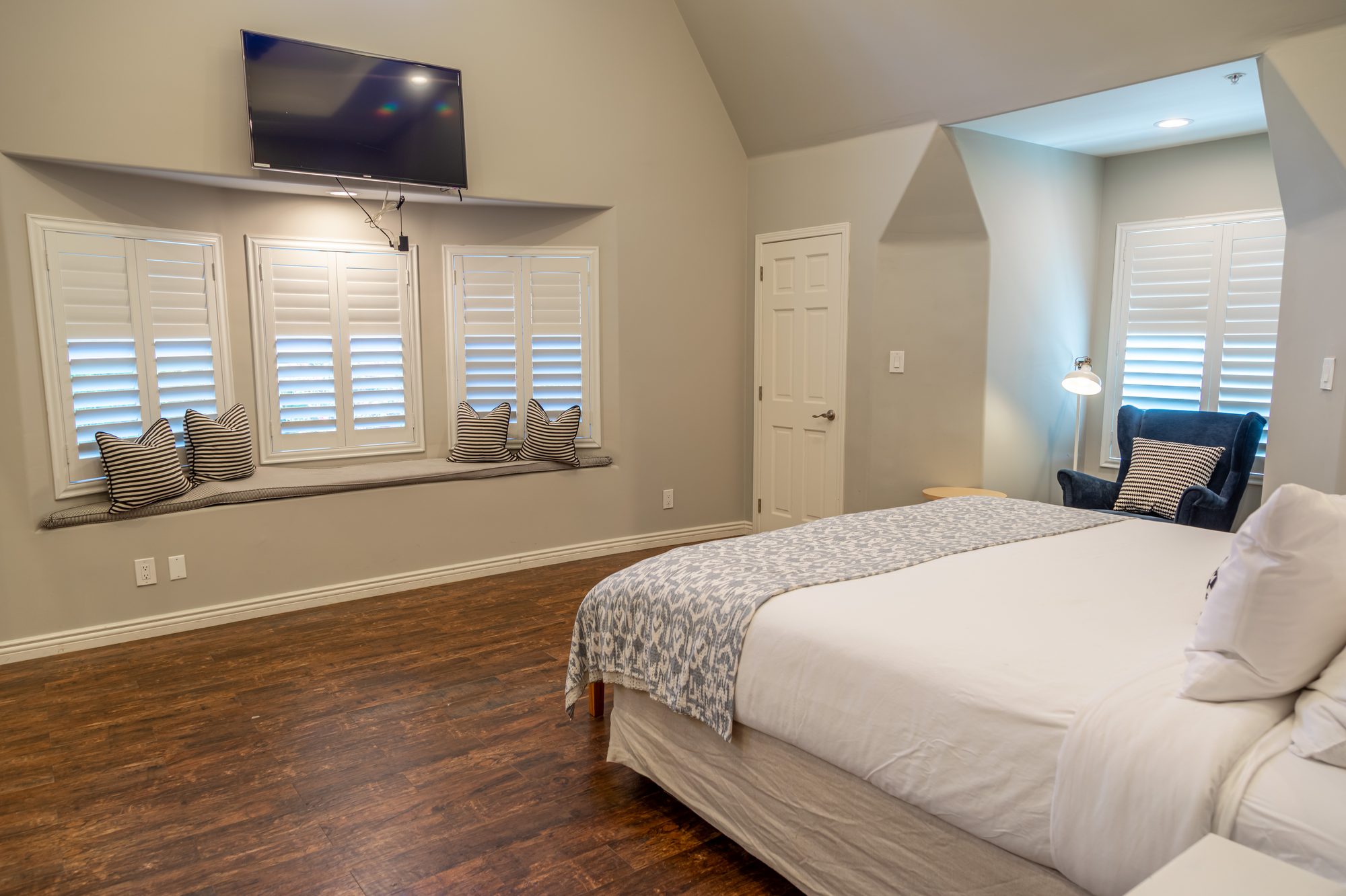 A bedroom suite at Lombardi House, window seat under the vaulted ceiling