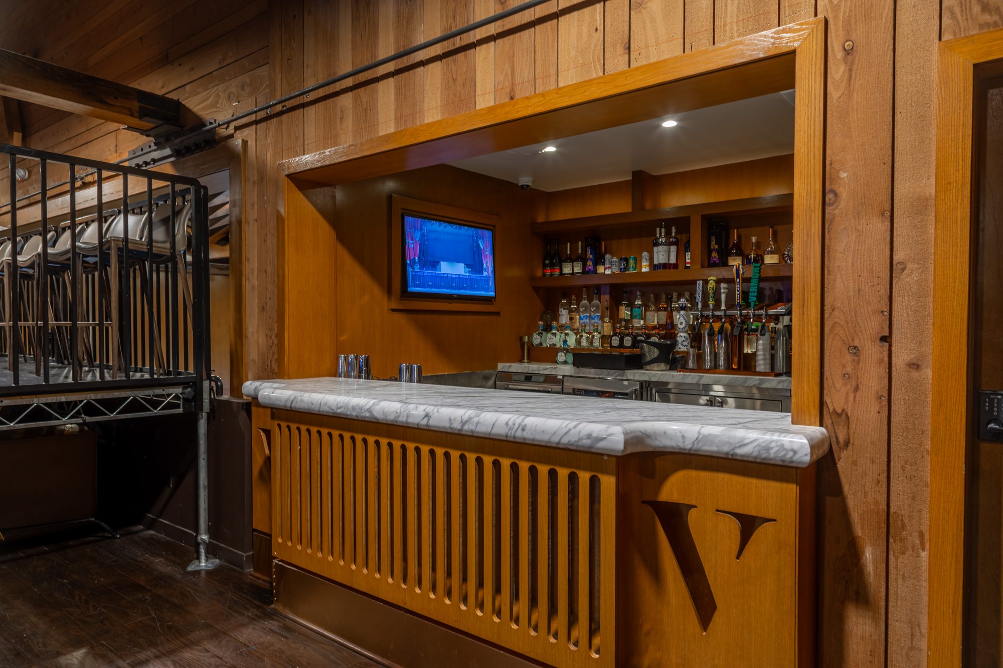 The panelled bar with the house monogram at The Vermont Hollywood